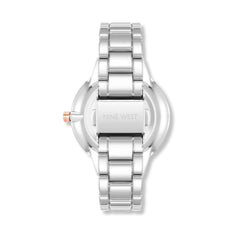 Reloj de pulsera con detalles de cristal para mujer marca Nine West. Brazalete de eslabones metálicos, ajustable, en color plata.